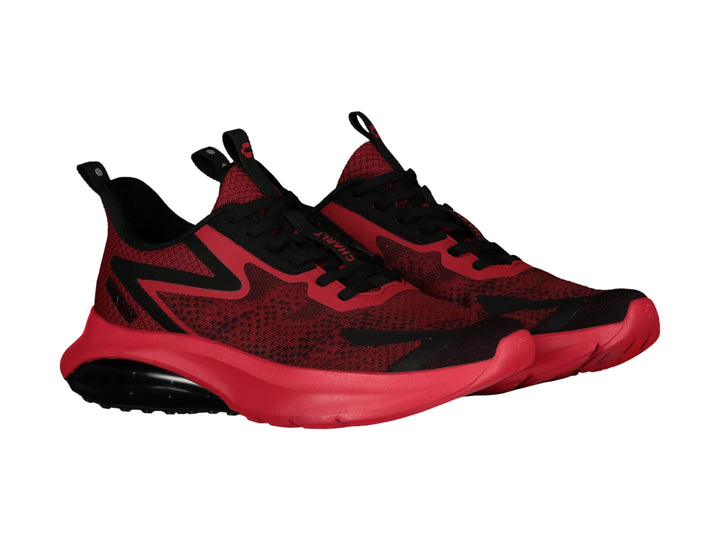 Tenis deportivos Charly en color rojo con detalles negros y suela amortiguada.