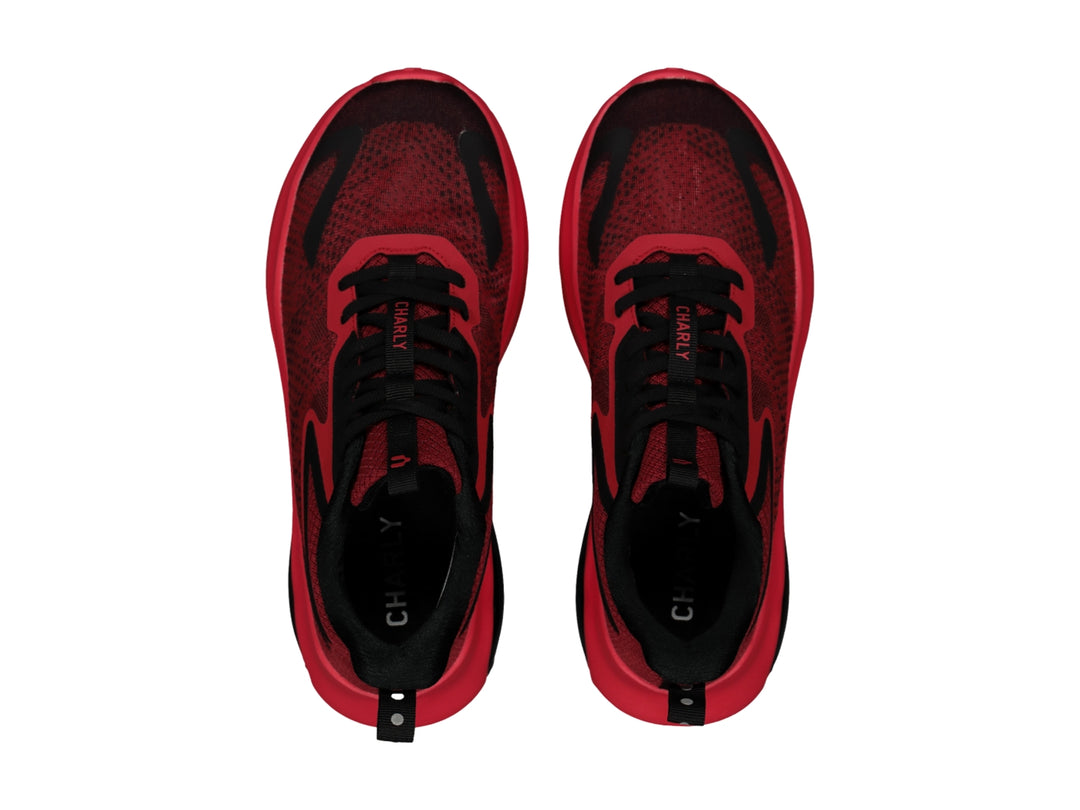 Tenis deportivos Charly en color rojo con detalles negros y suela amortiguada.