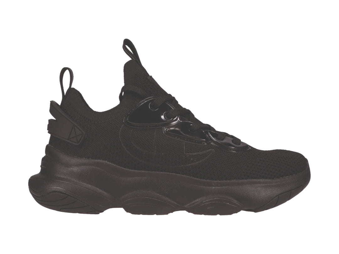 Tenis deportivos Champion color negro con suela gruesa y detalles en material sintético brillante.