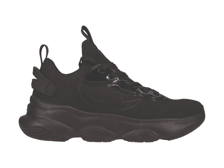 Tenis deportivos Champion color negro con suela gruesa y detalles en material sintético brillante.