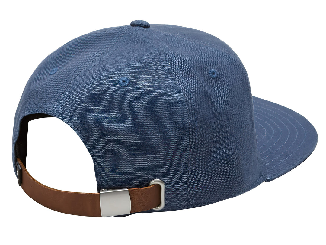 Gorra snapback azul oscuro con logotipo marrón frontal de Quiksilver.