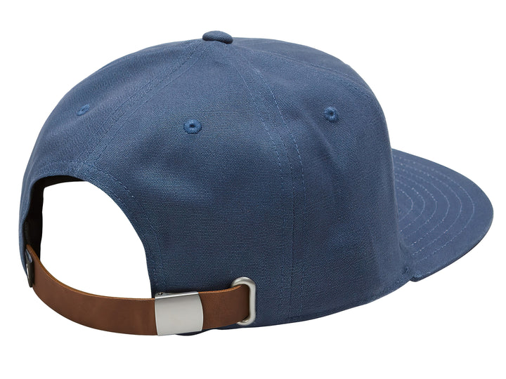 Gorra snapback azul oscuro con logotipo marrón frontal de Quiksilver.