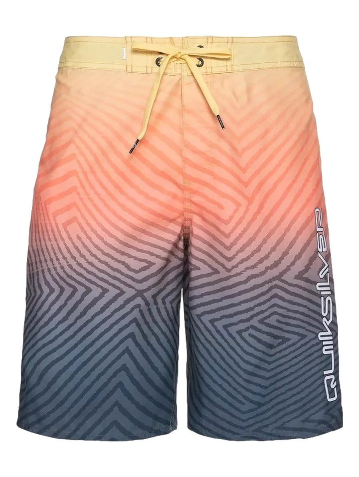 Traje de baño Quiksilver con patrón geométrico y degradado de color amarillo a azul marino.