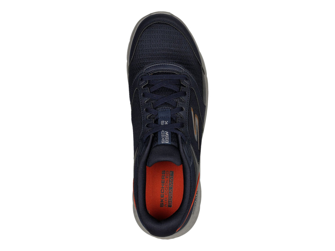 Tenis Skechers Go Walk Flex color azul marino con suela gris y detalles naranjas.
