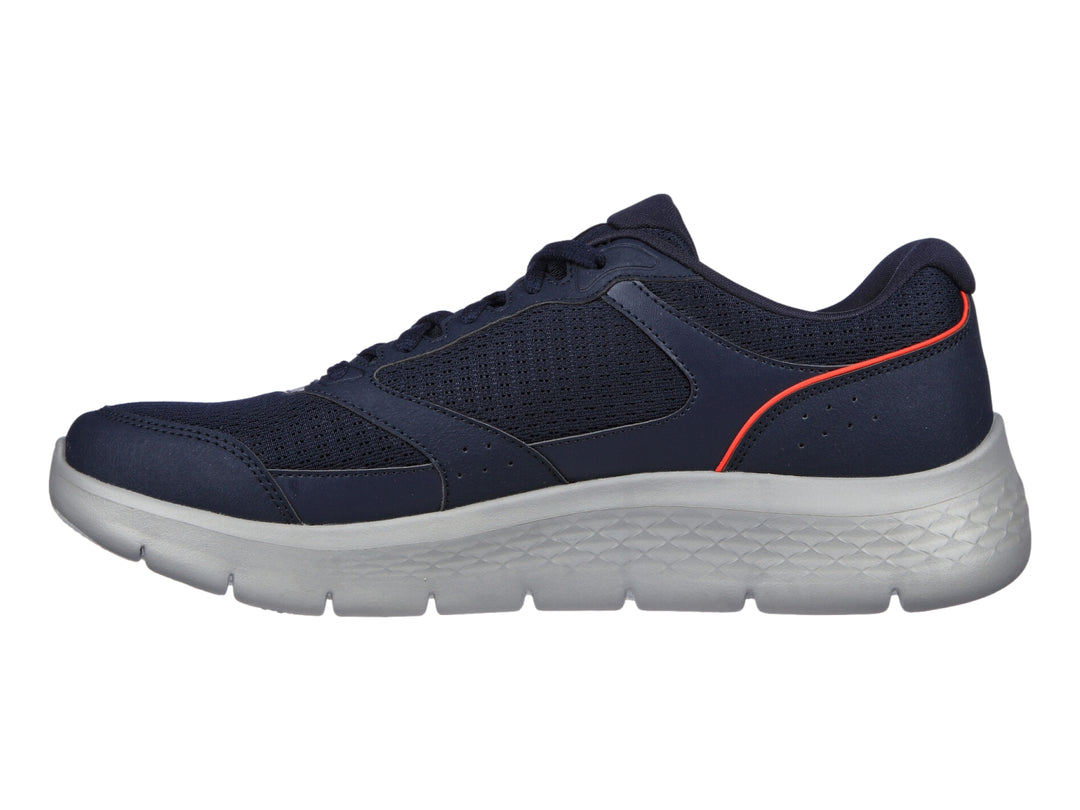 Tenis Skechers Go Walk Flex color azul marino con suela gris y detalles naranjas.