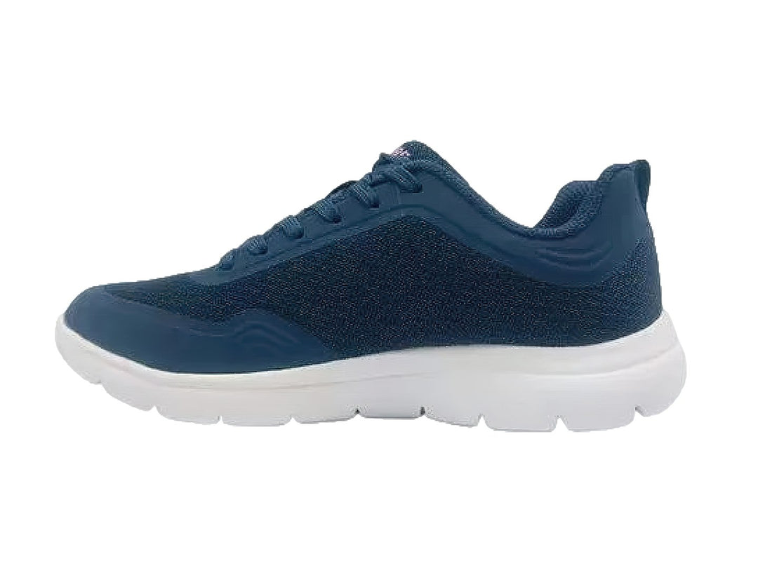 Tenis deportivos Skechers para mujer en color azul marino con suela blanca y detalles en rosa.