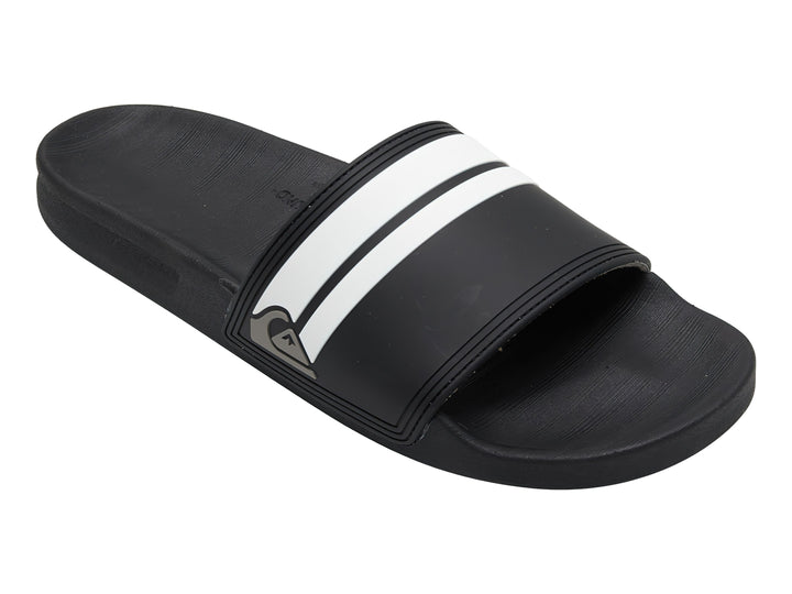 Sandalia slide Quiksilver de color negro con dos franjas blancas laterales y suela negra.