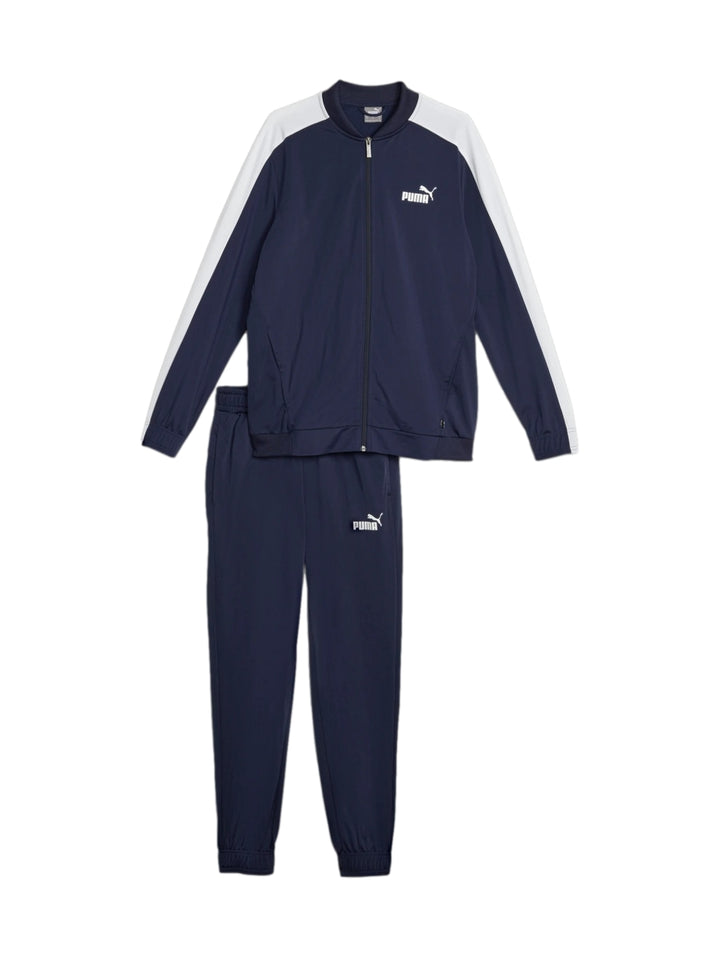 Conjunto deportivo PUMA azul marino con franjas blancas en los hombros, compuesto por chaqueta y pantalón.
