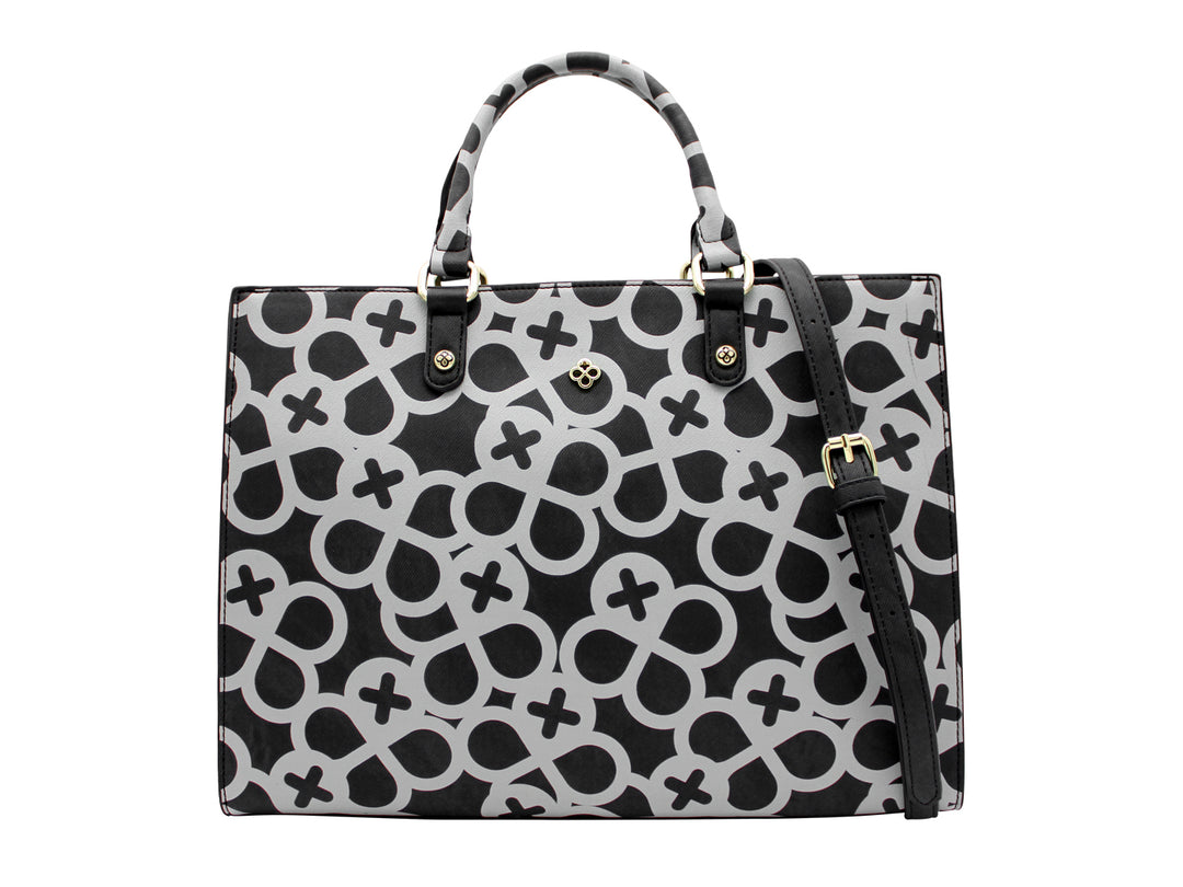 Bolso tote negro con estampado geométrico gris y detalles metálicos dorados.