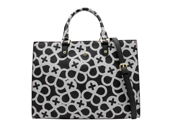 Bolso tote negro con estampado geométrico gris y detalles metálicos dorados.
