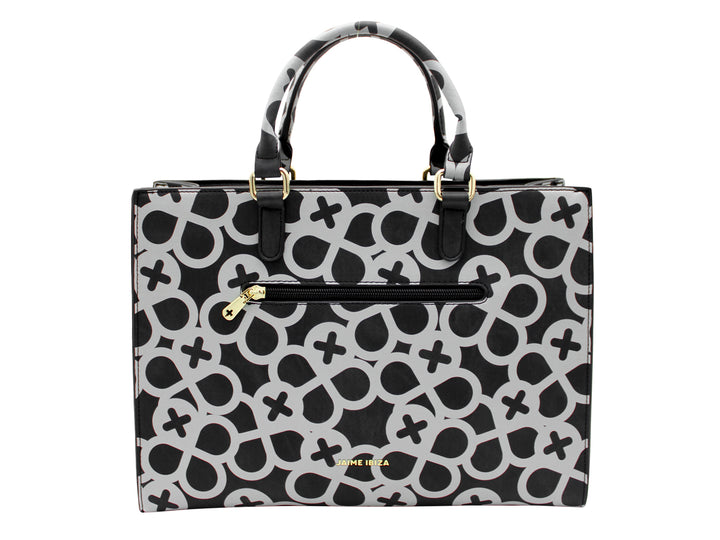 Bolso tote negro con estampado geométrico gris y detalles metálicos dorados.