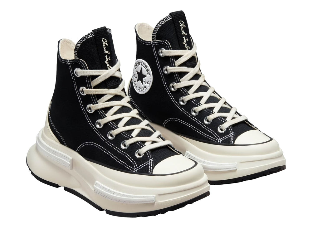 Tenis Converse Run Star Legacy CX color negro con suela blanca de plataforma elevada.
