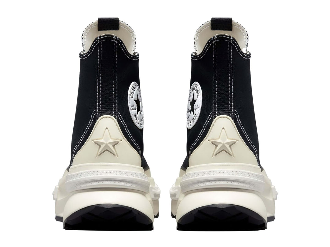 Tenis Converse Run Star Legacy CX color negro con suela blanca de plataforma elevada.