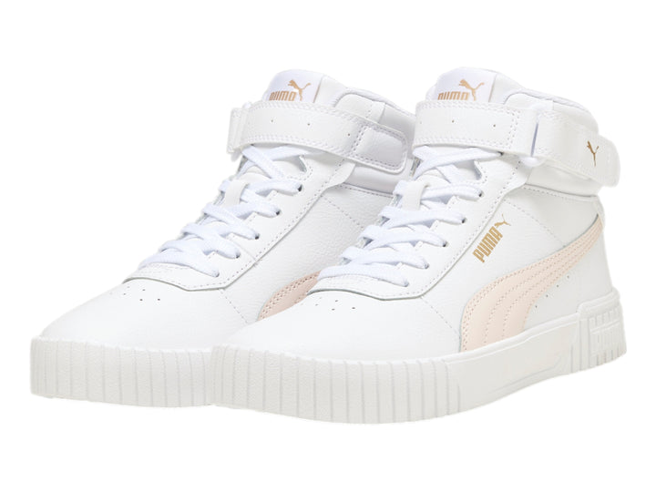 Tenis PUMA Carina 2.0 Mid en color blanco con detalles en rosa pastel y suela blanca ancha.
