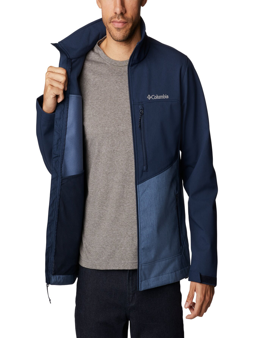 Chaqueta Columbia de dos tonos de azul con cierre frontal y cuello alto.