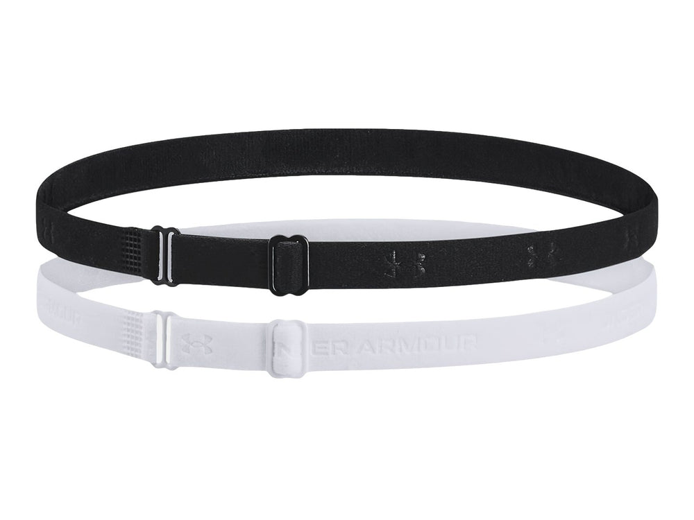 Set de dos bandas elásticas ajustables Under Armour en colores negro y blanco sobre fondo blanco.