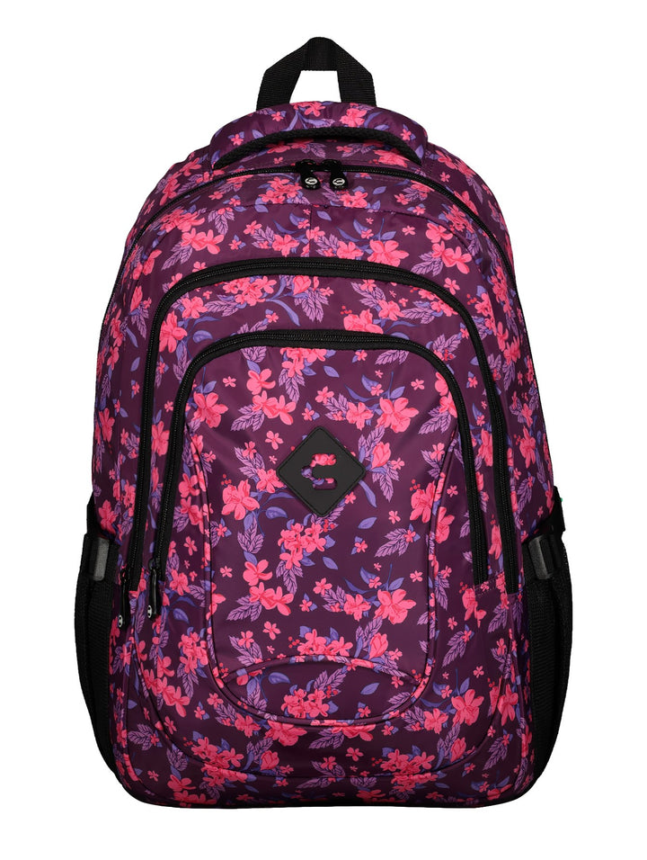 Mochila unisex Charly con estampado floral en tonos fucsia y morado, con detalles y cierres en color negro.