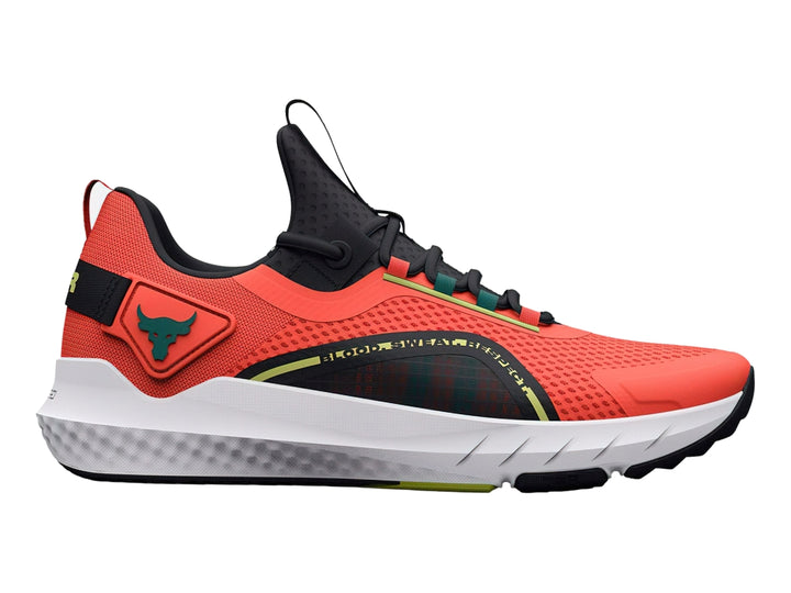 Tenis deportivos Under Armour Project Rock color naranja con suela blanca y detalles en negro y verde.