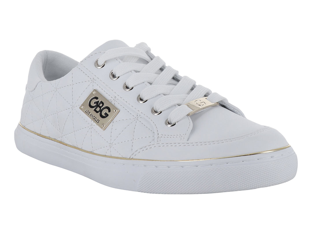 Tenis blancos con detalles dorados y textura acolchada lateral.