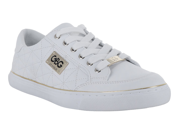 Tenis blancos con detalles dorados y textura acolchada lateral.