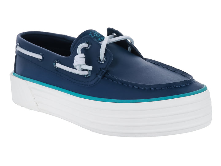 Zapato náutico Sperry de cuero azul marino con suela de plataforma blanca y detalle en turquesa.
