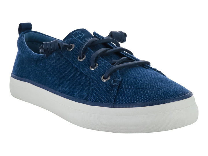 Tenis casuales Sperry de color azul con suela blanca y cordones azules.