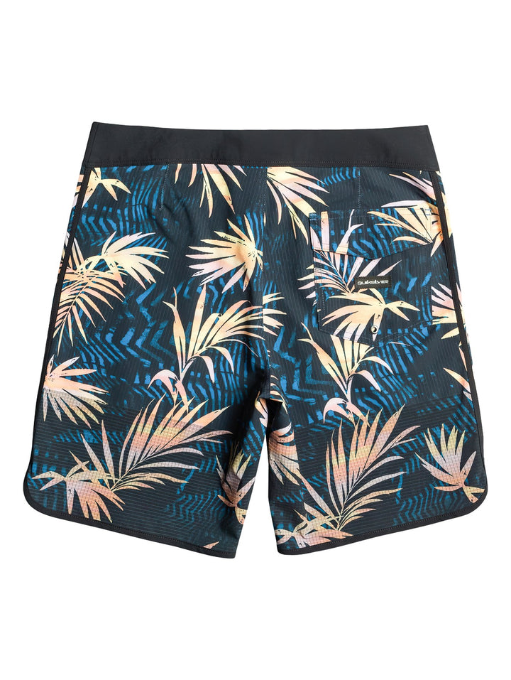Traje de baño Quiksilver negro con estampado de hojas tropicales en tonos azul y amarillo.