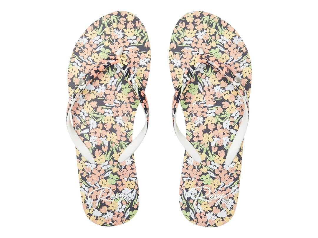 Sandalias ROXY Portofino III con estampado floral, suela azul marino y base color durazno.
