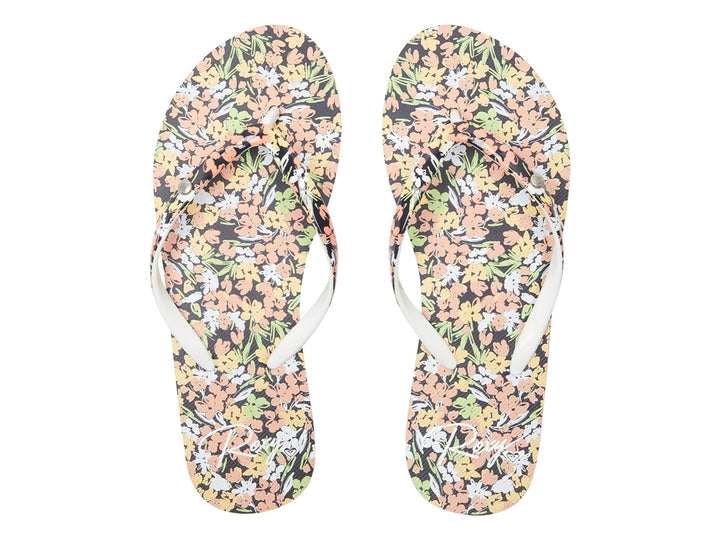 Sandalias ROXY Portofino III con estampado floral, suela azul marino y base color durazno.