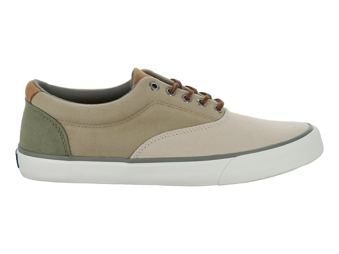Zapatilla casual Sperry de lona color beige con suela blanca y cordones cafés.