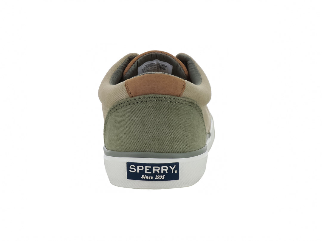 Zapatilla casual Sperry de lona color beige con suela blanca y cordones cafés.