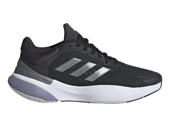 Tenis deportivos Adidas Response Super 3.0 en color negro con suela blanca y detalles en gris.