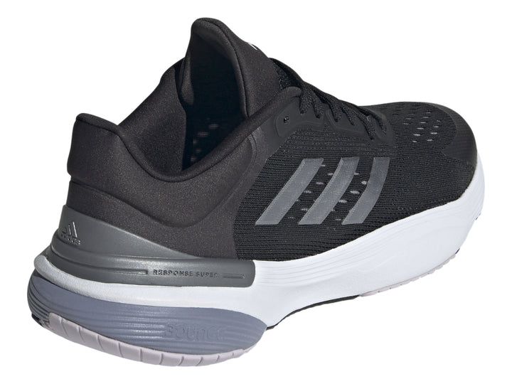 Tenis deportivos Adidas Response Super 3.0 en color negro con suela blanca y detalles en gris.