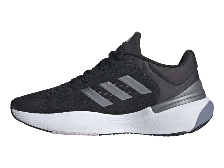 Tenis deportivos Adidas Response Super 3.0 en color negro con suela blanca y detalles en gris.