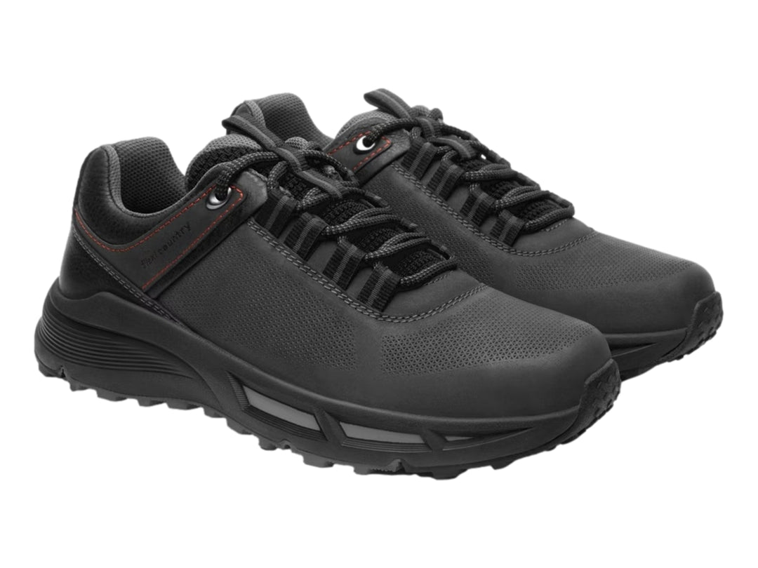 Zapato casual negro Flexi con suela gruesa y detalles de costuras rojas.