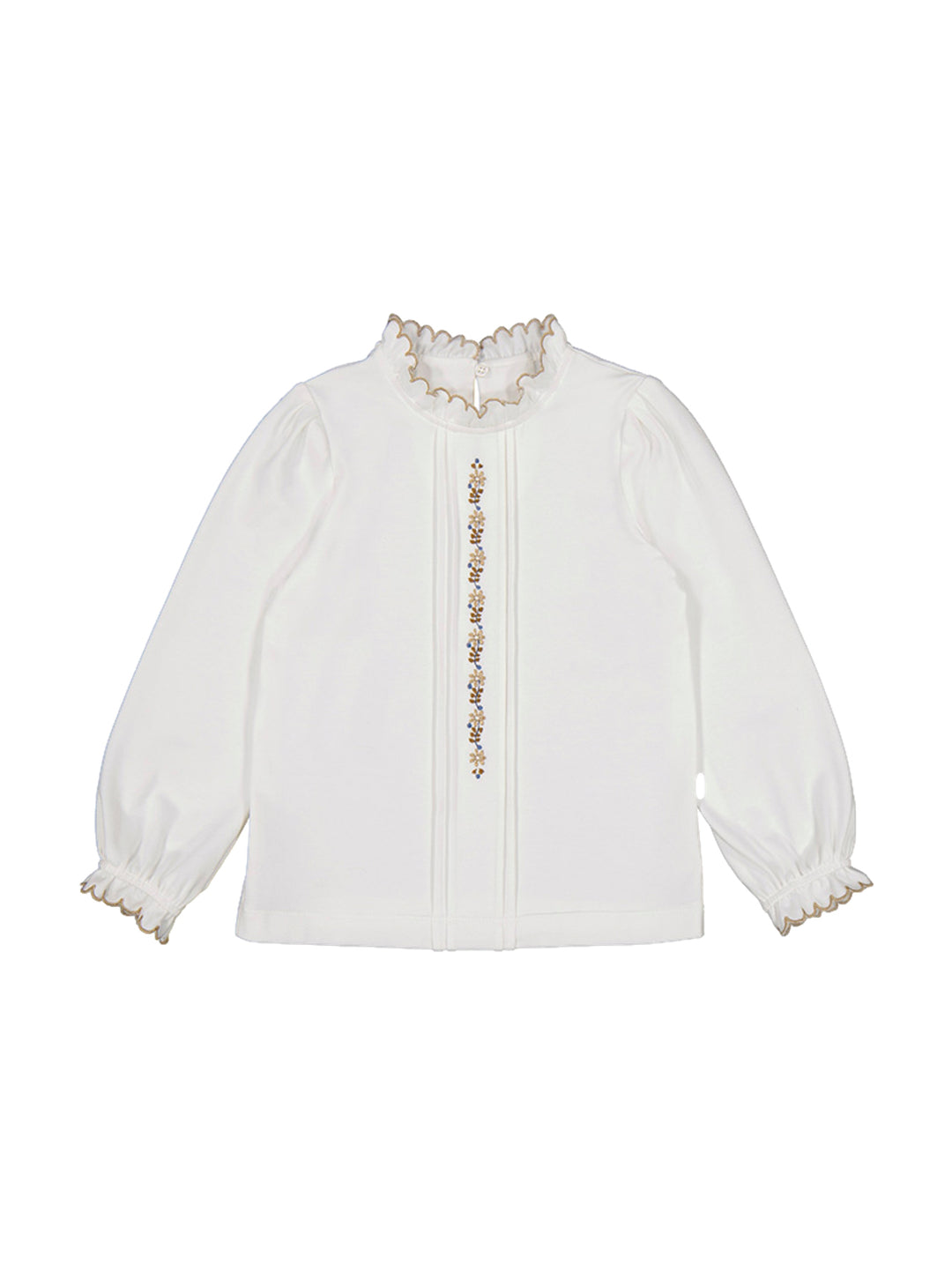 Blusa blanca de manga larga con bordado floral central y detalles ondulados en cuello y puños.