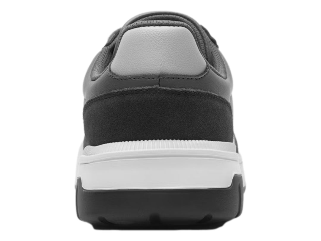 Tenis casuales Flexi color gris con suela blanca y negra, vista lateral.