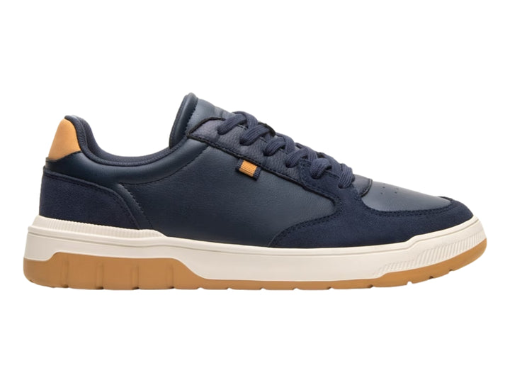 Tenis Flexi color azul marino con detalles en miel y suela blanca y miel.