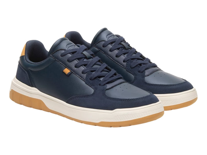 Tenis Flexi color azul marino con detalles en miel y suela blanca y miel.