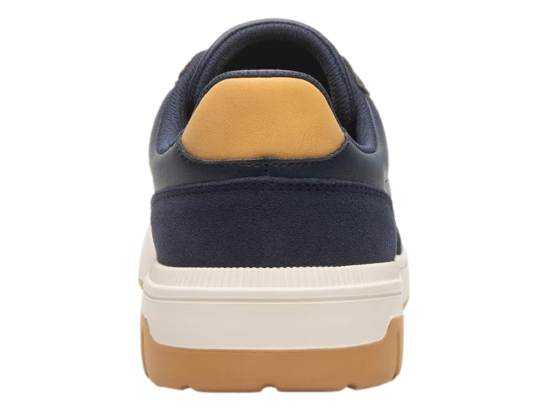 Tenis Flexi color azul marino con detalles en miel y suela blanca y miel.