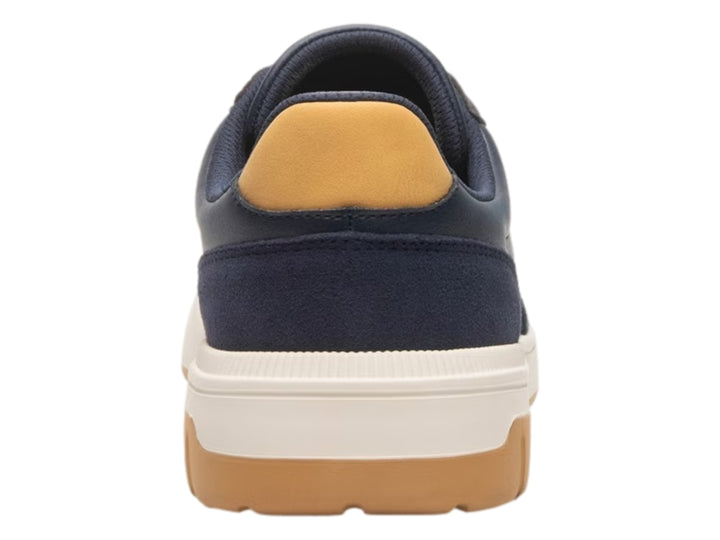 Tenis Flexi color azul marino con detalles en miel y suela blanca y miel.