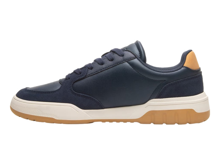 Tenis Flexi color azul marino con detalles en miel y suela blanca y miel.