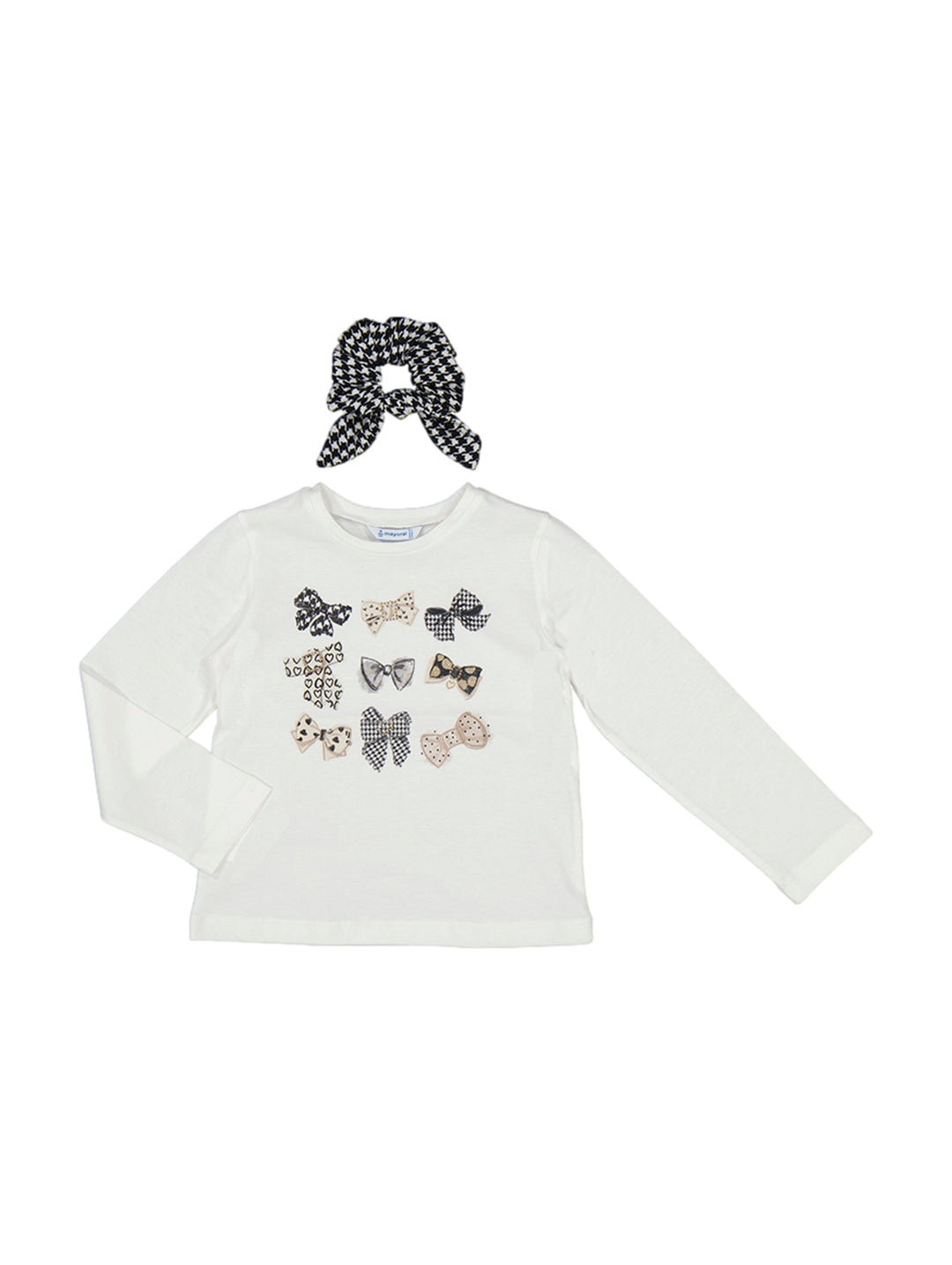 Conjunto de camiseta blanca de manga larga con moños decorativos y coletero a juego en blanco y negro.
