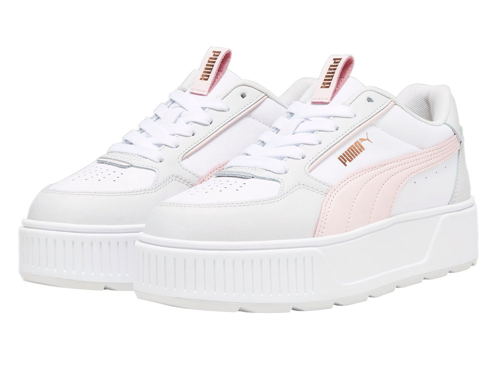 Tenis PUMA blancos con detalles en rosa y gris y suela de plataforma blanca.