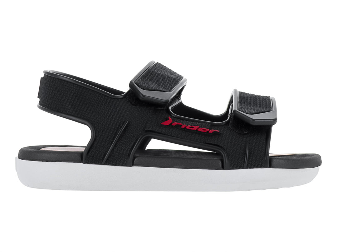 Sandalia infantil Rider color negro con suela blanca y correas ajustables de velcro.