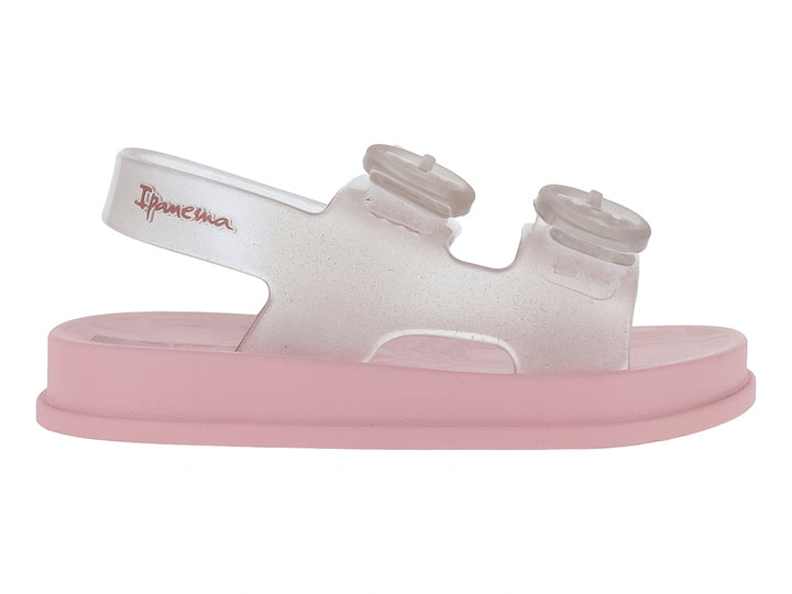 Sandalias rosa con correas transparentes con glitter y hebillas.