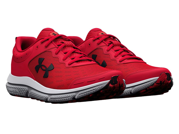 Tenis deportivos Under Armour color rojo con suela blanca y logotipo negro.