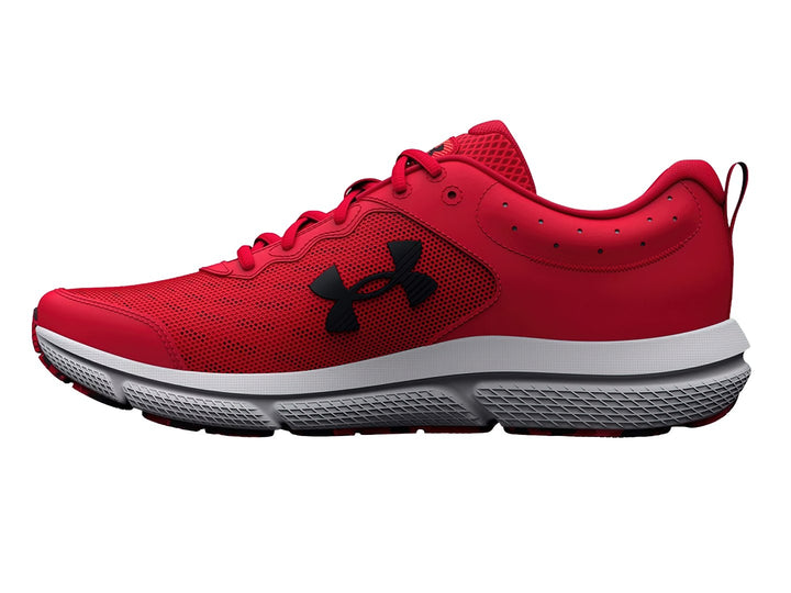 Tenis deportivos Under Armour color rojo con suela blanca y logotipo negro.