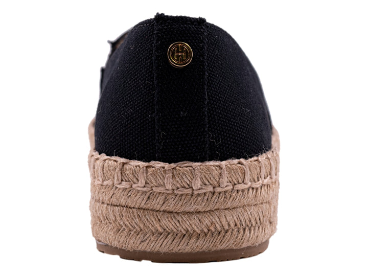 Zapato tipo alpargata color negro con suela de cuerda beige natural para mujer.