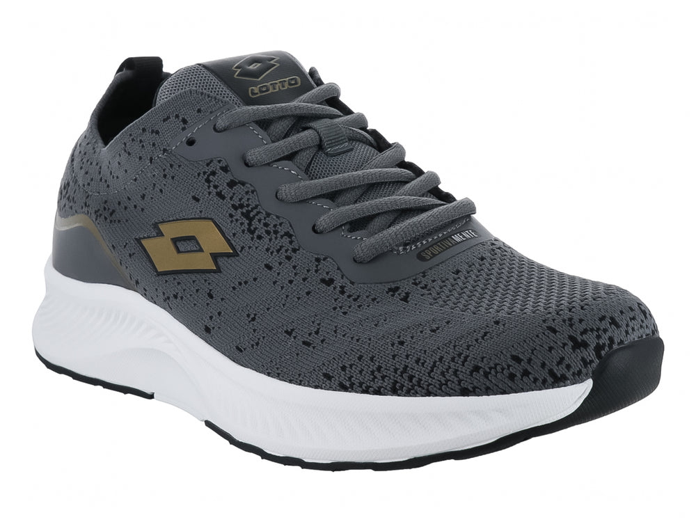 Tenis deportivos Lotto color gris oscuro con detalles dorados y suela blanca.